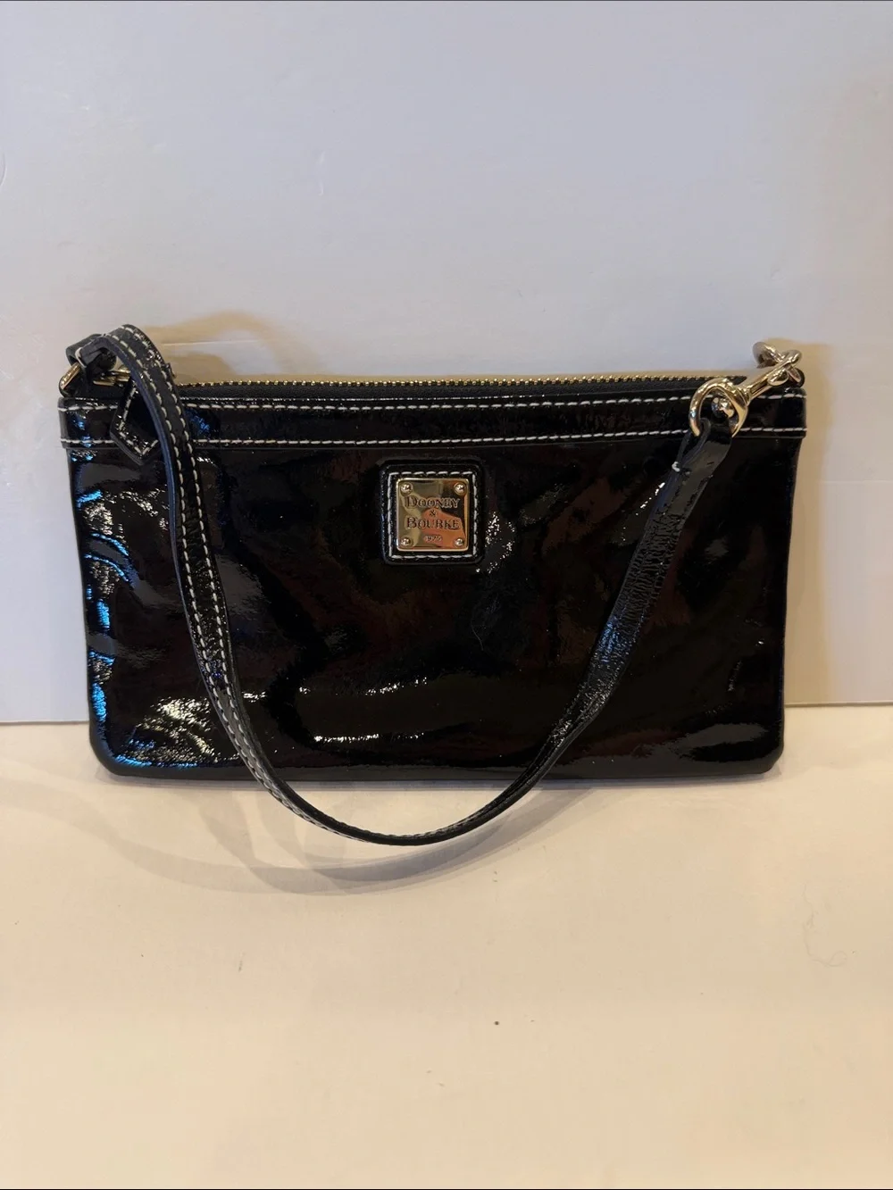 Dooney & Bourke Black Patent Wristlet Clutch with Logo Plaque